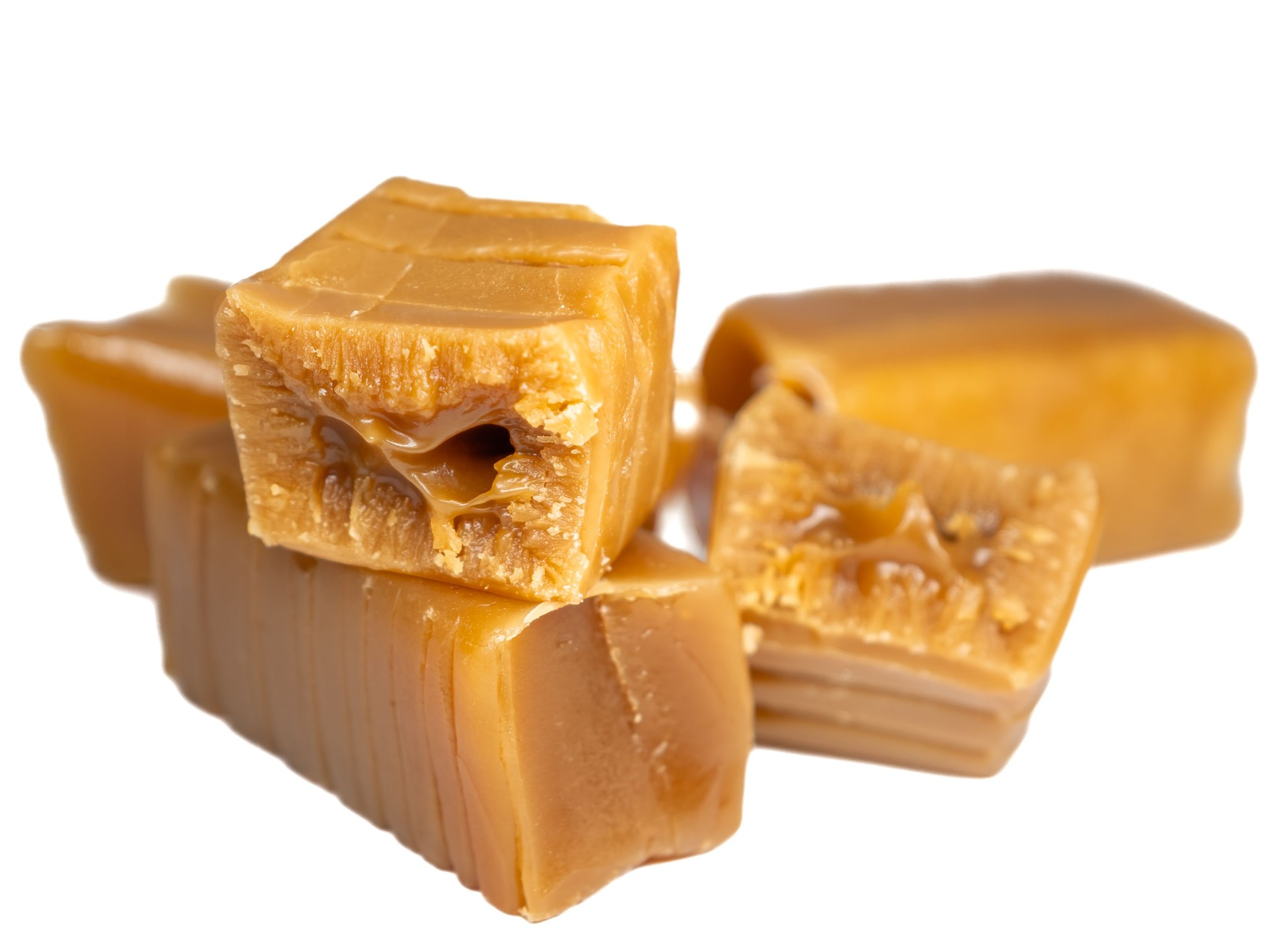 sweet caramel fudge close-up, cross-section and whole on a white background